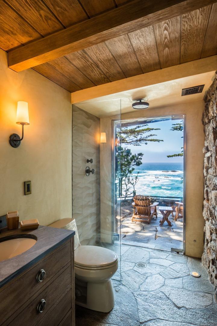157-163 Spindrift Road Carmel, CA 93923 - Photo 28 of 100 a bathroom with a granite countertop sink and a mirror