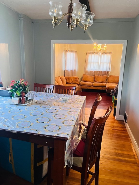 53 Hillside Avenue Everett, MA 02149 - Photo 2 of 11 a view of a dining room with furniture window and outside view