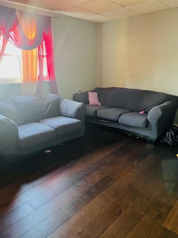 53 Hillside Avenue Everett, MA 02149 - Photo 9 of 11 a living room with furniture and a window