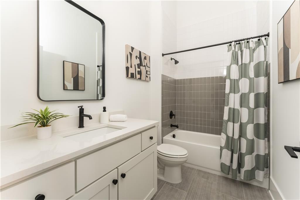 1160 Gracewood Avenue Southeast, Unit 111 Atlanta, GA 30316 - Photo 22 of 38 a bathroom with a sink a toilet and shower