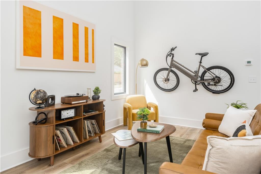 1160 Gracewood Avenue Southeast, Unit 111 Atlanta, GA 30316 - Photo 23 of 38 a view of a dining room with furniture and a chandelier
