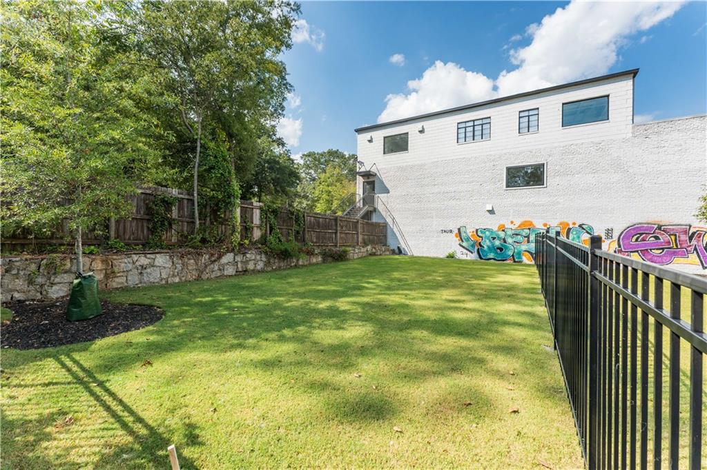 1160 Gracewood Avenue Southeast, Unit 111 Atlanta, GA 30316 - Photo 27 of 38 a front view of a house with garden