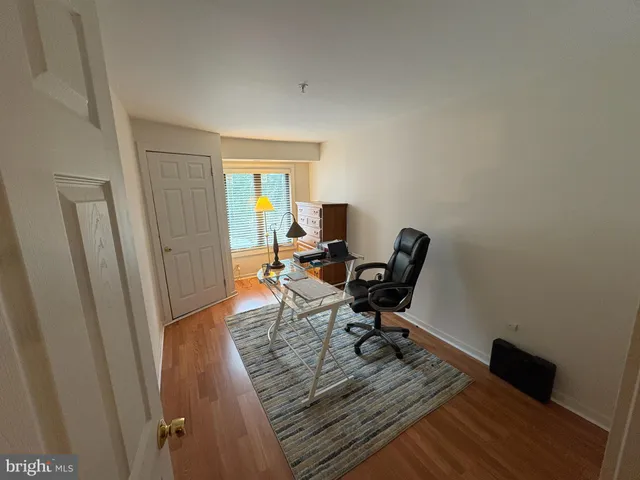 a workspace with furniture and wooden floor