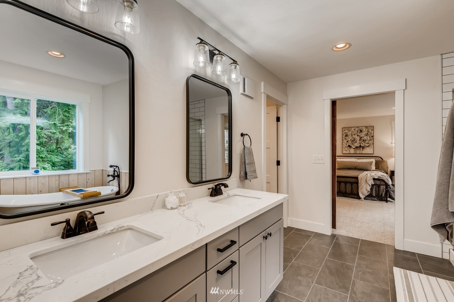 28313 Florence Acres Road Monroe, WA 98272 - Photo 13 of 27 a en suite bathroom with double vanity and a mirror