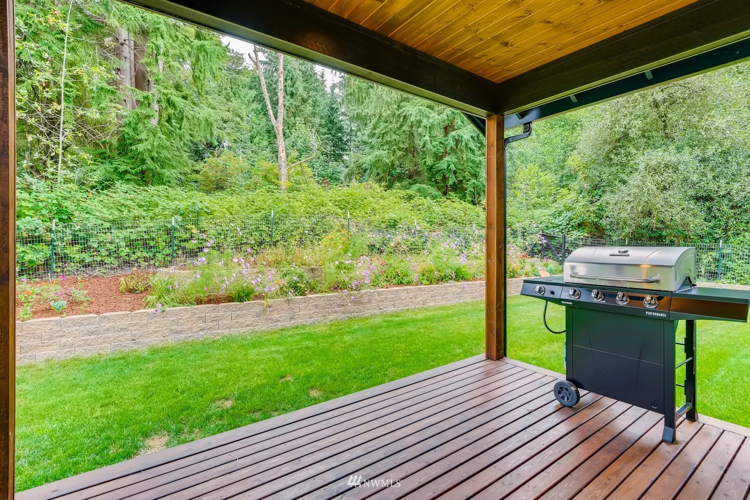 28313 Florence Acres Road Monroe, WA 98272 - Photo 23 of 27 a patio with wooden floor table and chairs
