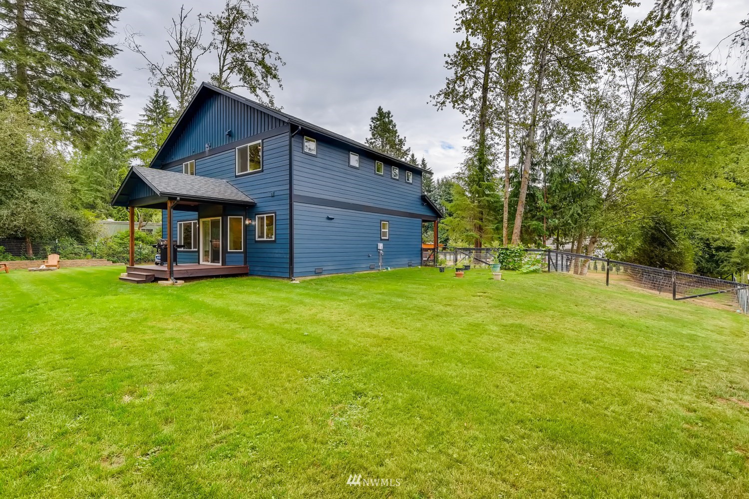 28313 Florence Acres Road Monroe, WA 98272 - Photo 24 of 27 a view of a house with a big yard potted plants and large tree