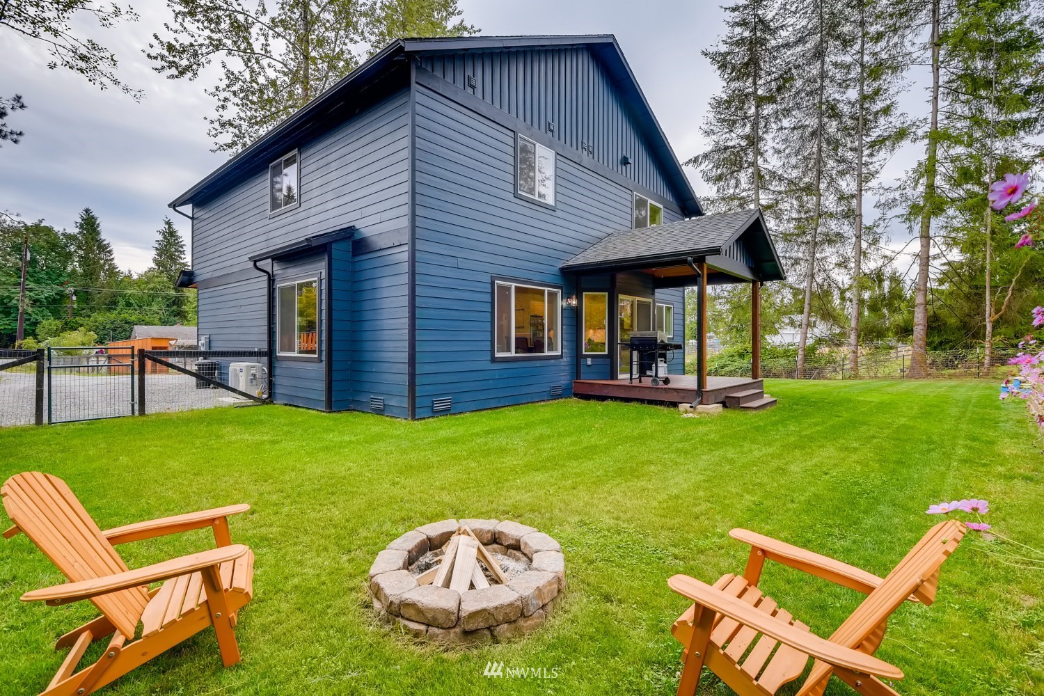 28313 Florence Acres Road Monroe, WA 98272 - Photo 25 of 27 a backyard of a house with table and chairs