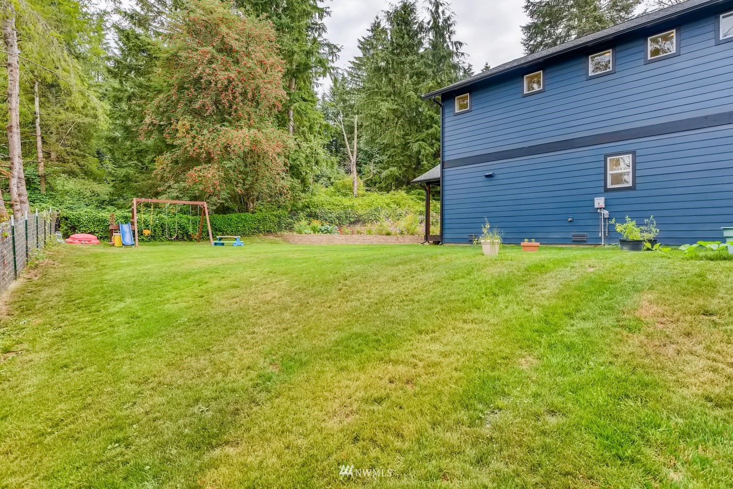 28313 Florence Acres Road Monroe, WA 98272 - Photo 26 of 27 a view of a backyard with a garden