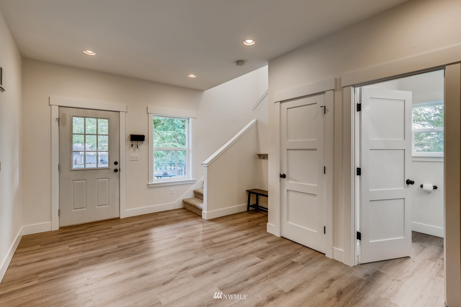 28313 Florence Acres Road Monroe, WA 98272 - Photo 3 of 27 a view of an empty room with wooden floor and a window