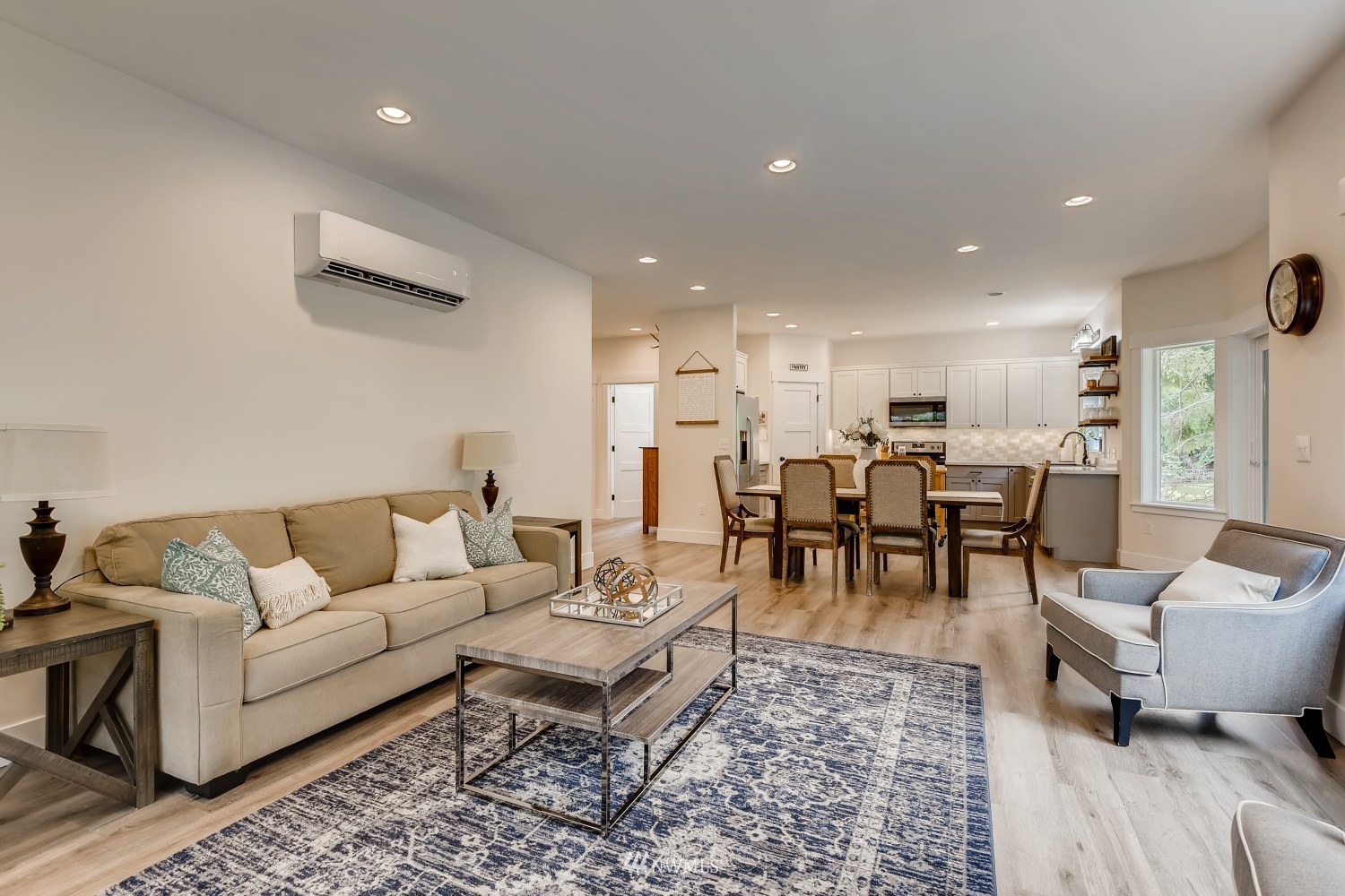 28313 Florence Acres Road Monroe, WA 98272 - Photo 6 of 27 a living room with furniture and a dining table with wooden floor