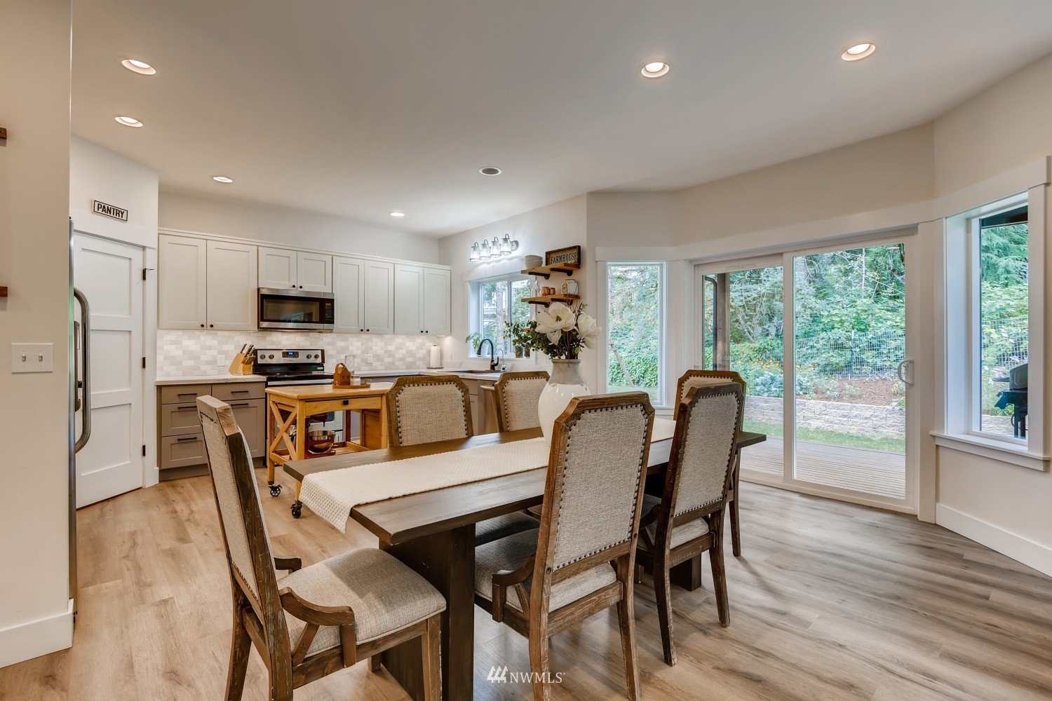 28313 Florence Acres Road Monroe, WA 98272 - Photo 7 of 27 a view of a dining room with furniture and wooden floor