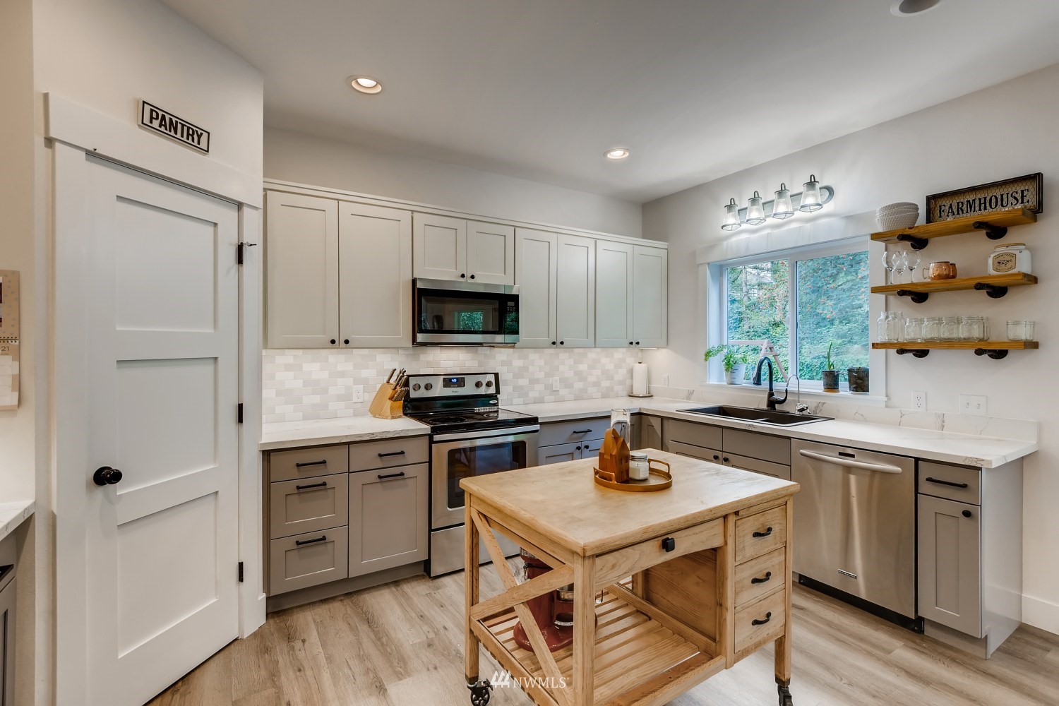 28313 Florence Acres Road Monroe, WA 98272 - Photo 8 of 27 a kitchen with a stove a sink and a refrigerator