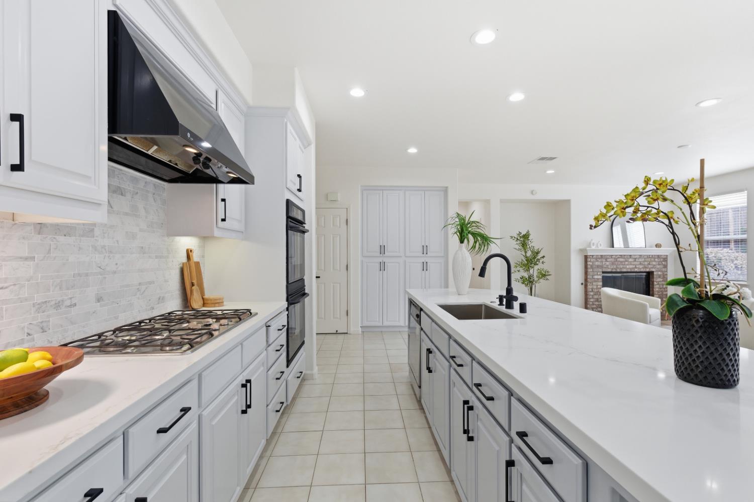 1012 Rock Harbor Point Hercules, CA 94547 - Photo 11 of 53 a kitchen with stainless steel appliances kitchen island granite countertop a sink stove and cabinets