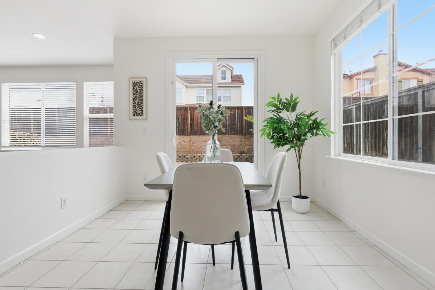 1012 Rock Harbor Point Hercules, CA 94547 - Photo 13 of 53 a view of a dining room with furniture and a potted plant