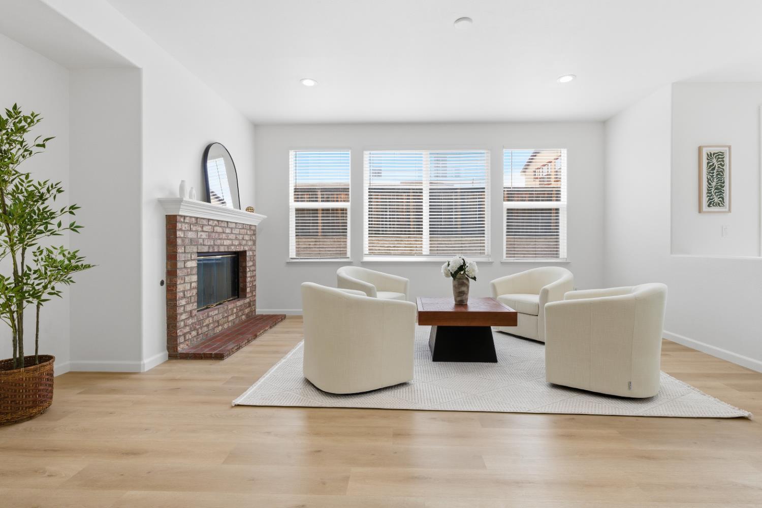 1012 Rock Harbor Point Hercules, CA 94547 - Photo 18 of 53 a living room with couches a fireplace and a potted plant