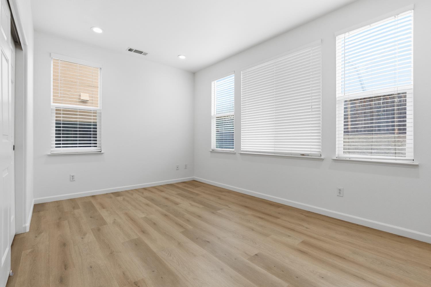 1012 Rock Harbor Point Hercules, CA 94547 - Photo 19 of 53 a view of an empty room with wooden floor and a window