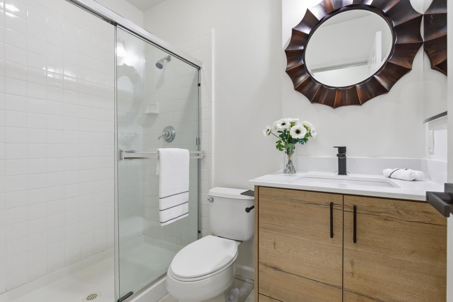1012 Rock Harbor Point Hercules, CA 94547 - Photo 20 of 53 a bathroom with a toilet sink and mirror