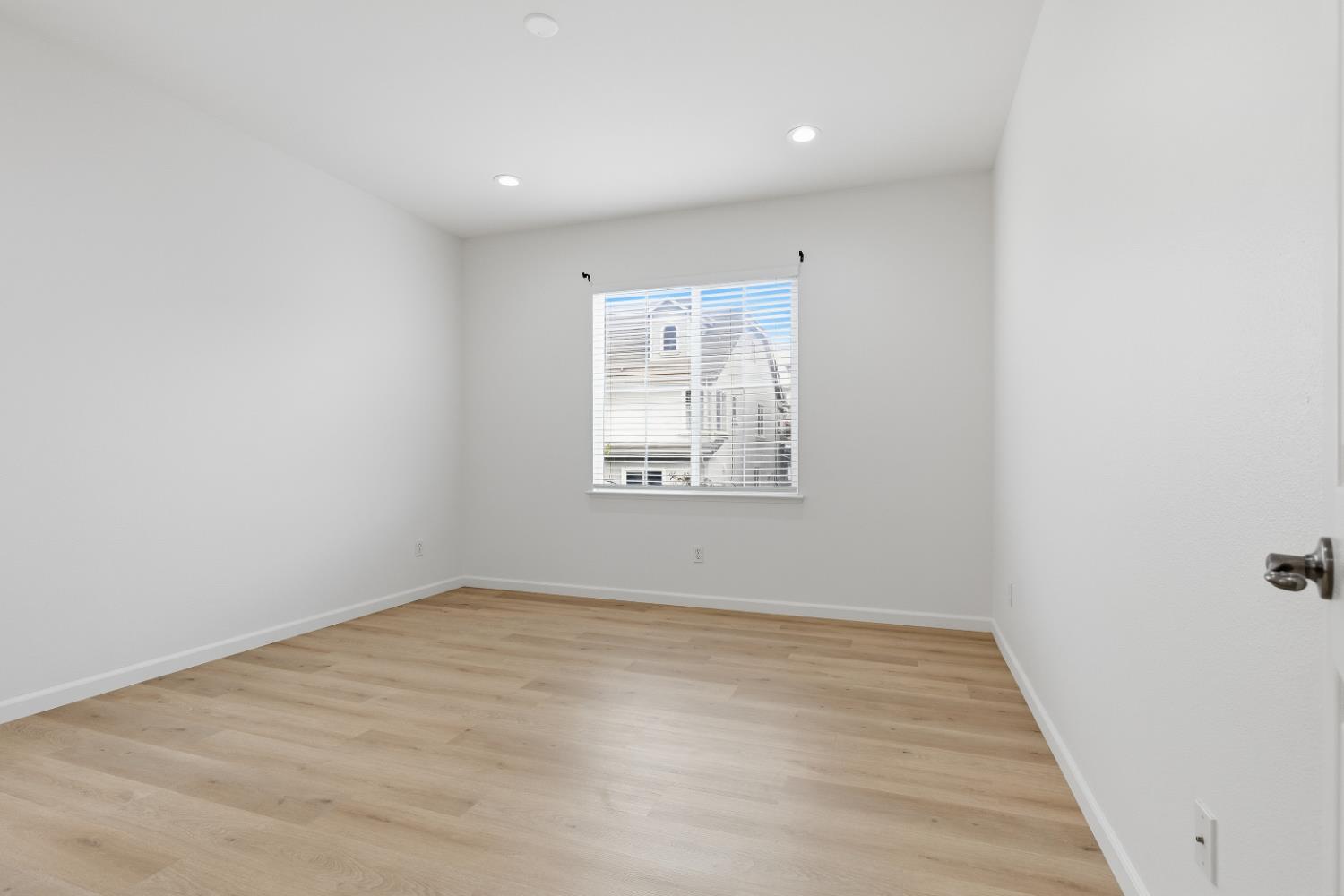 1012 Rock Harbor Point Hercules, CA 94547 - Photo 23 of 53 an empty room with wooden floor and windows