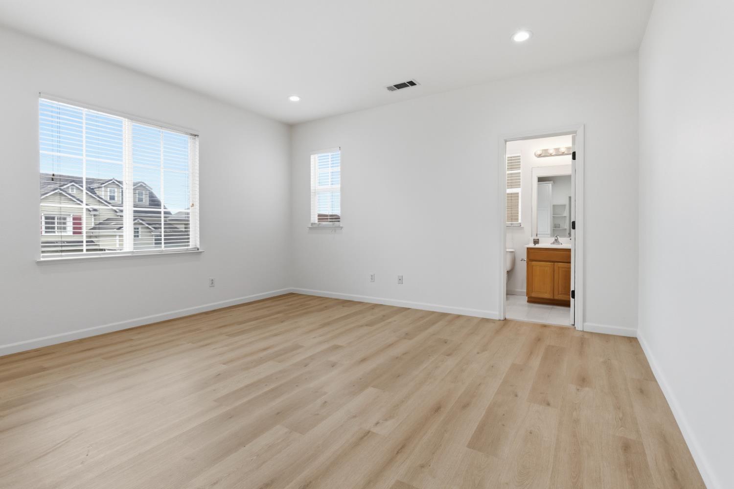 1012 Rock Harbor Point Hercules, CA 94547 - Photo 25 of 53 an empty room with wooden floor and windows