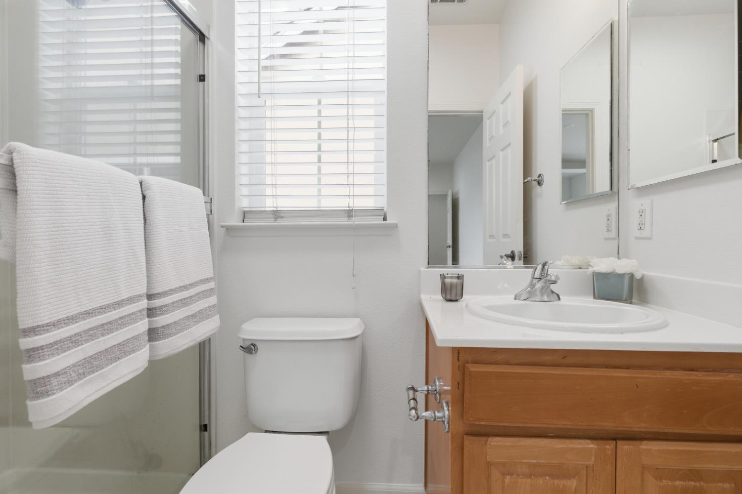1012 Rock Harbor Point Hercules, CA 94547 - Photo 26 of 53 a bathroom with a granite countertop toilet sink and mirror