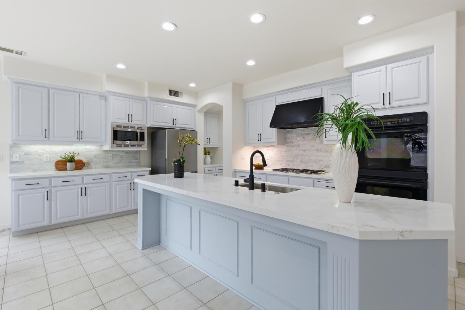 1012 Rock Harbor Point Hercules, CA 94547 - Photo 10 of 53 a kitchen with a sink stainless steel appliances and white cabinets