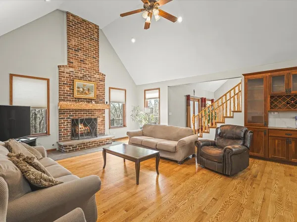 a bathroom with a granite countertop sink toilet and mirror