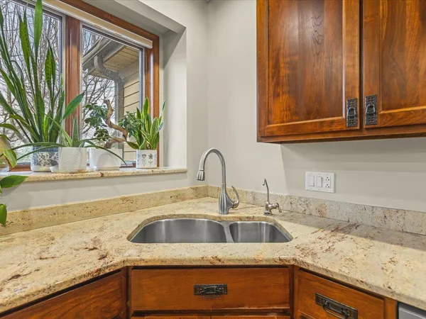 a bathroom with a tub sink and mirror