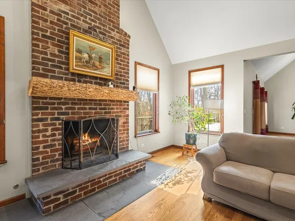 a view of a livingroom with furniture and a flat screen tv