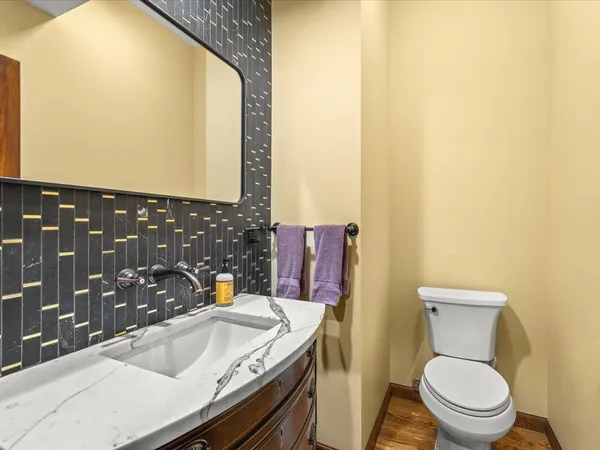 a bathroom with a shower sink and mirror