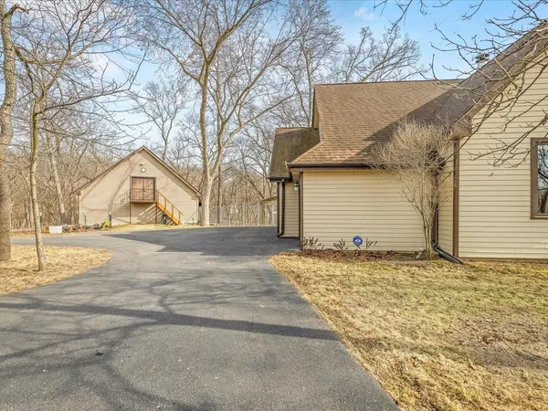 a living room with fireplace furniture and a flat screen tv