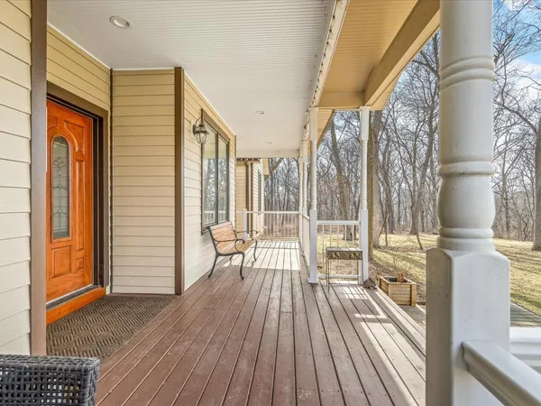 a view of entryway with wooden floor