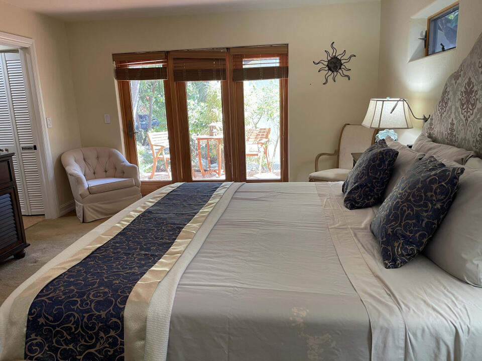 57967 Morton Street Marathon, FL 33050 - Photo 2 of 7 a bedroom with a bed and window