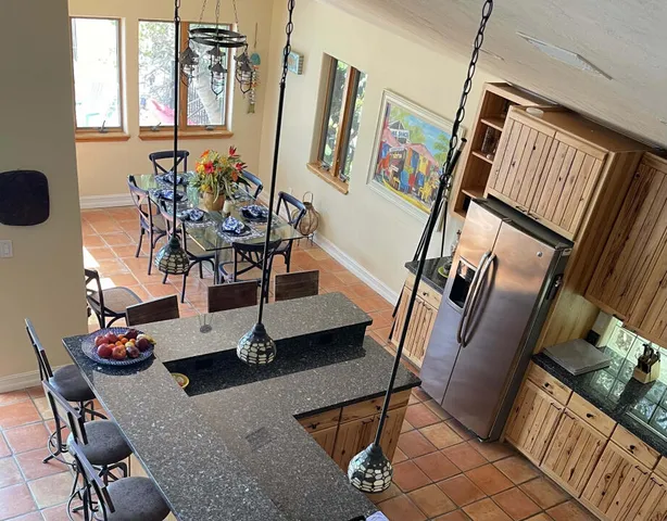 a view of a livingroom with furniture hardwood floor and staircase
