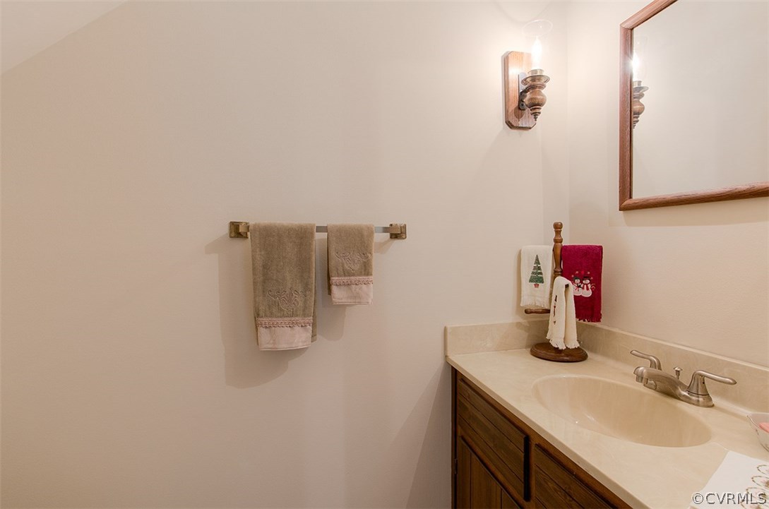 624 Fennimore Road Midlothian, VA 23114 - Photo 17 of 28 a bathroom with a sink and a mirror