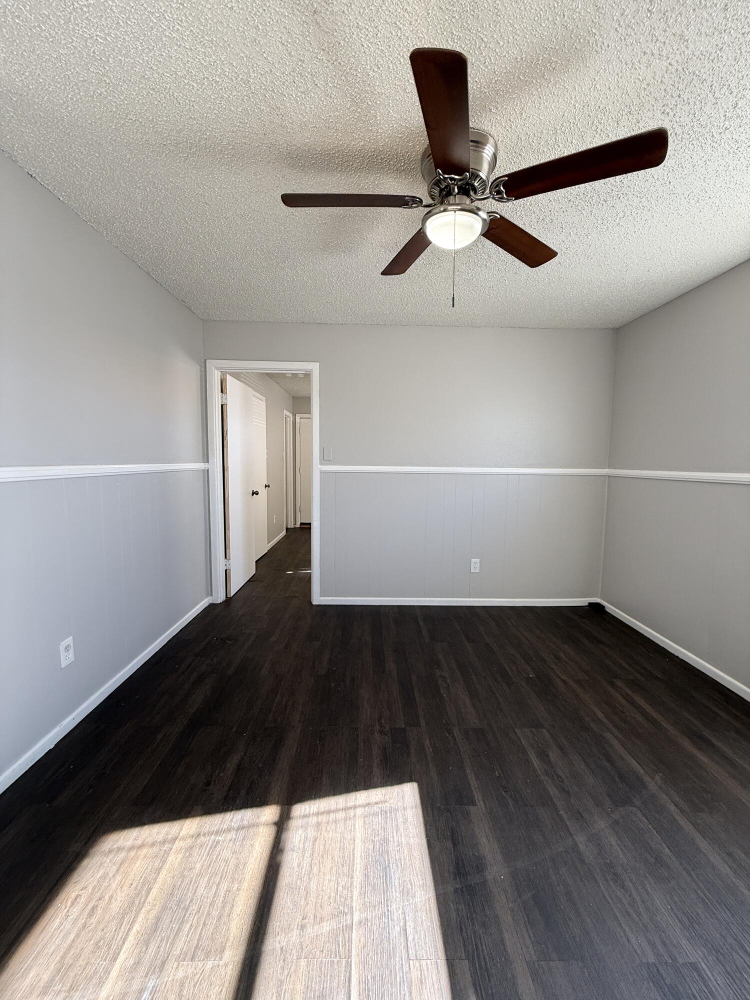 922 44th Street, Unit A Lubbock, TX 79412 - Photo 5 of 16 a view of wooden floor in a room