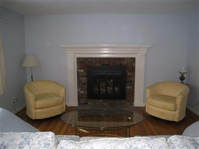 69 Valley Brook Road Centerville, MA 02632 - Photo 8 of 14 a living room with furniture and a fireplace