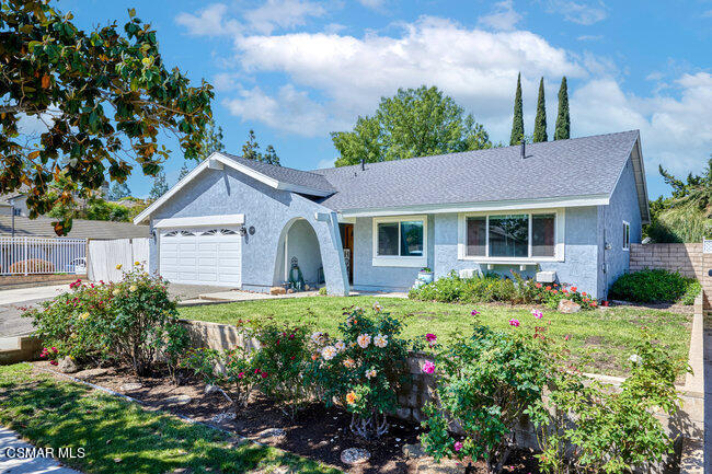 1097 Waltham Road Simi Valley, CA 93065 - Photo 1 of 37 a front view of a house with a yard