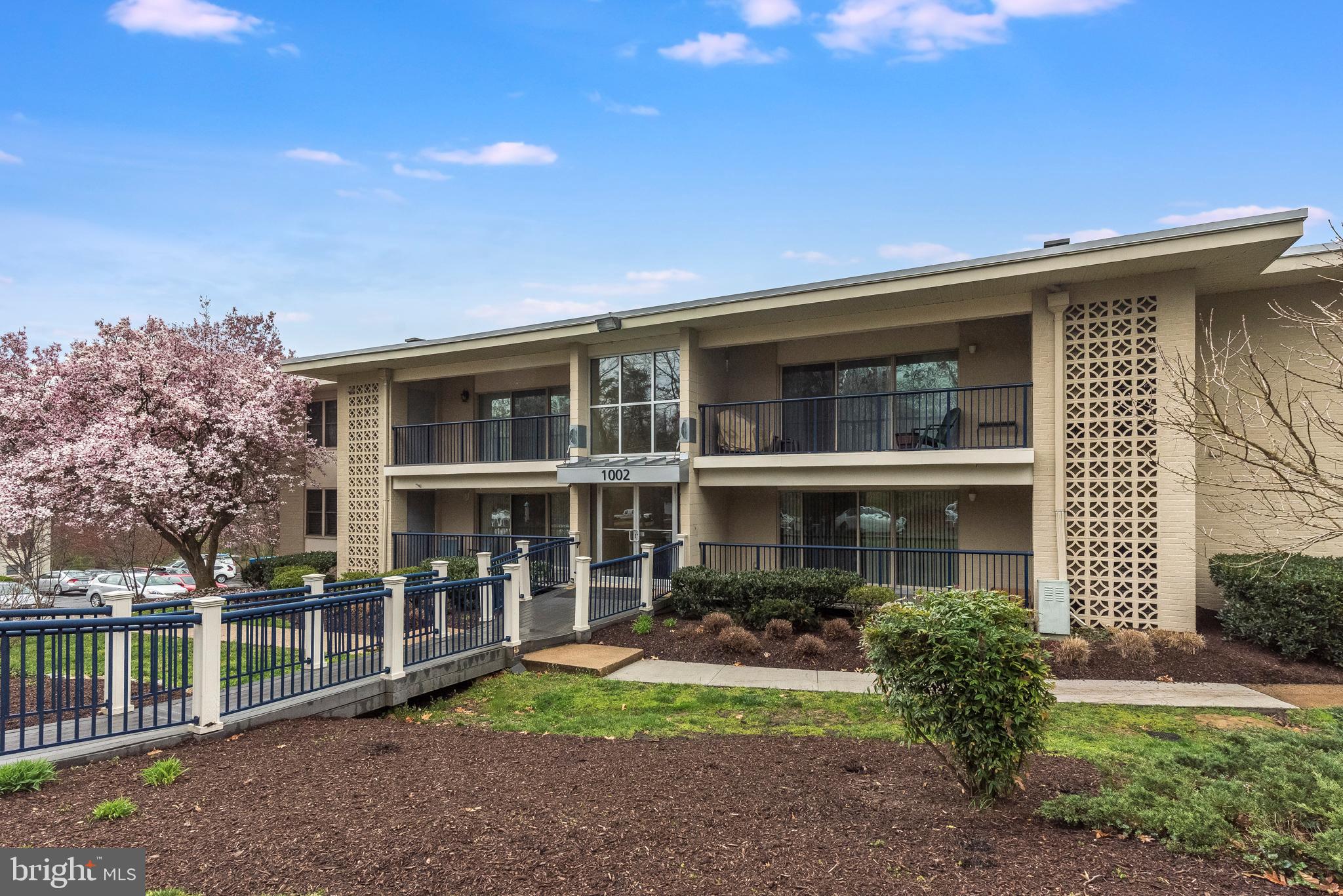 1002 Primrose Road, Unit 203 Annapolis, MD 21403 - Photo 2 of 46 Front of Building with Beautiful Flowering Tree
