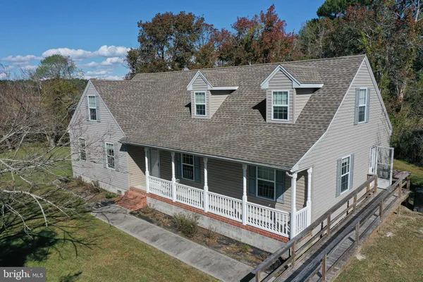 a aerial view of a house with a yard