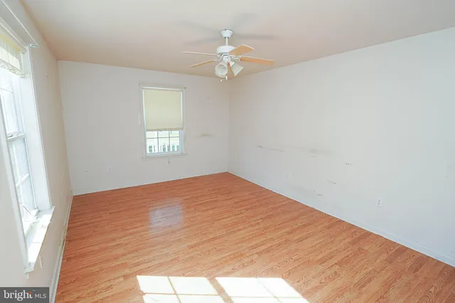 a view of a room with wooden floor