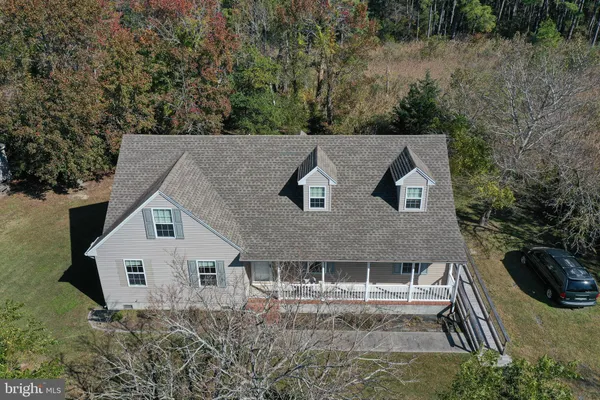 a aerial view of a house with a yard