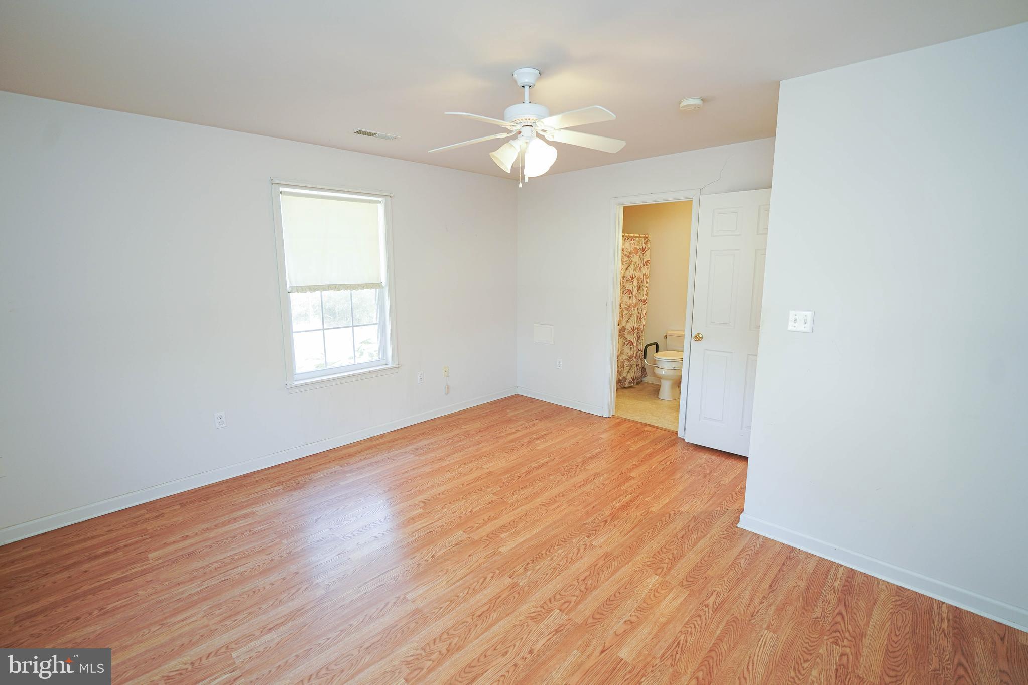 23290 Custom House Road Deal Island, MD 21821 - Photo 25 of 64 wooden floor in an empty room with a window