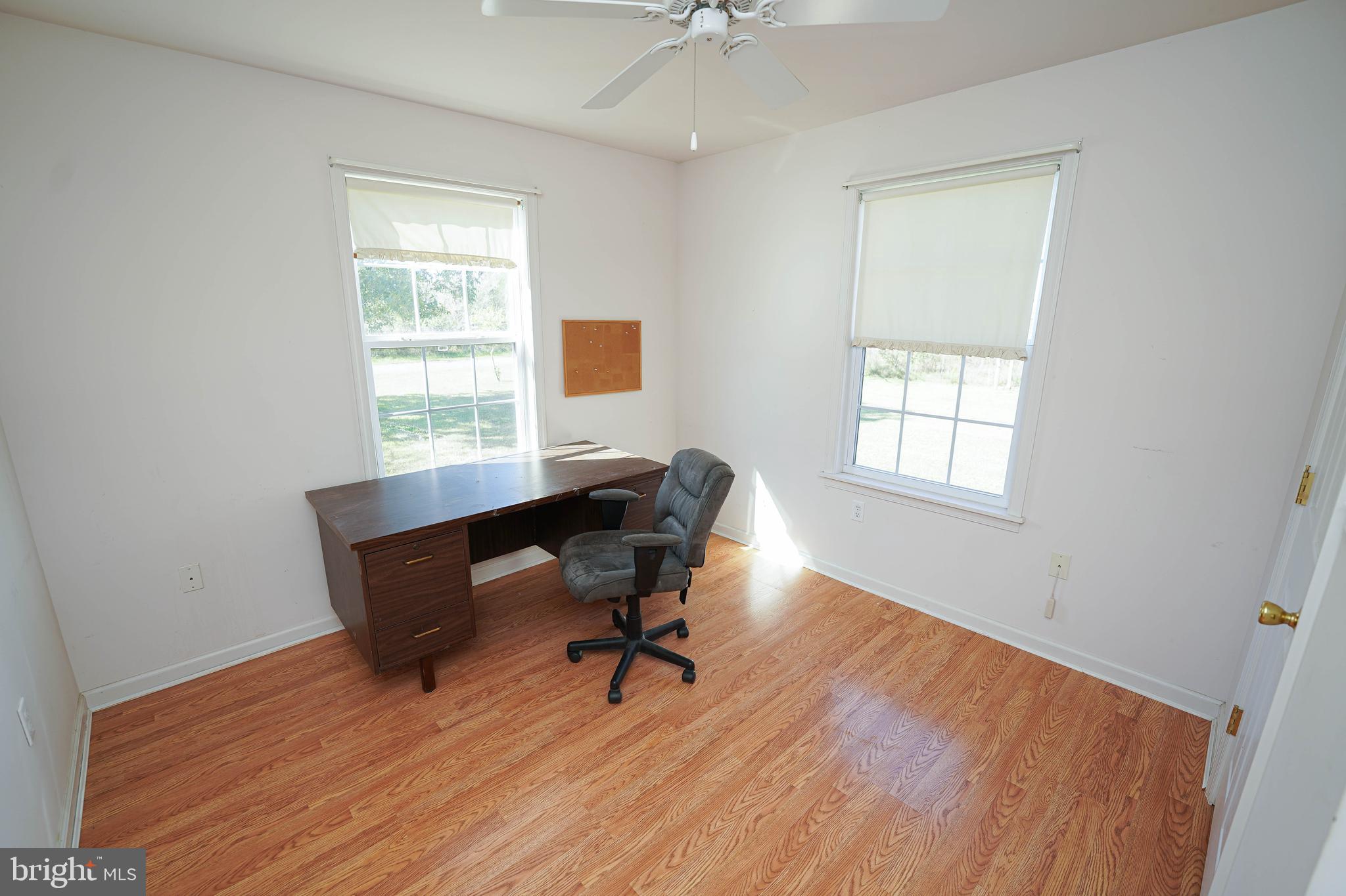 23290 Custom House Road Deal Island, MD 21821 - Photo 29 of 64 a view of a workspace with furniture and a window