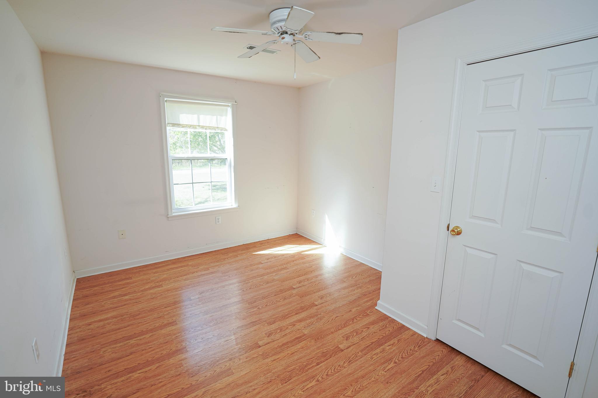 23290 Custom House Road Deal Island, MD 21821 - Photo 36 of 64 wooden floor in an empty room with a window