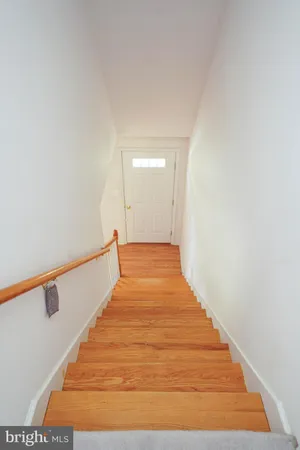 an empty room with windows and cabinet