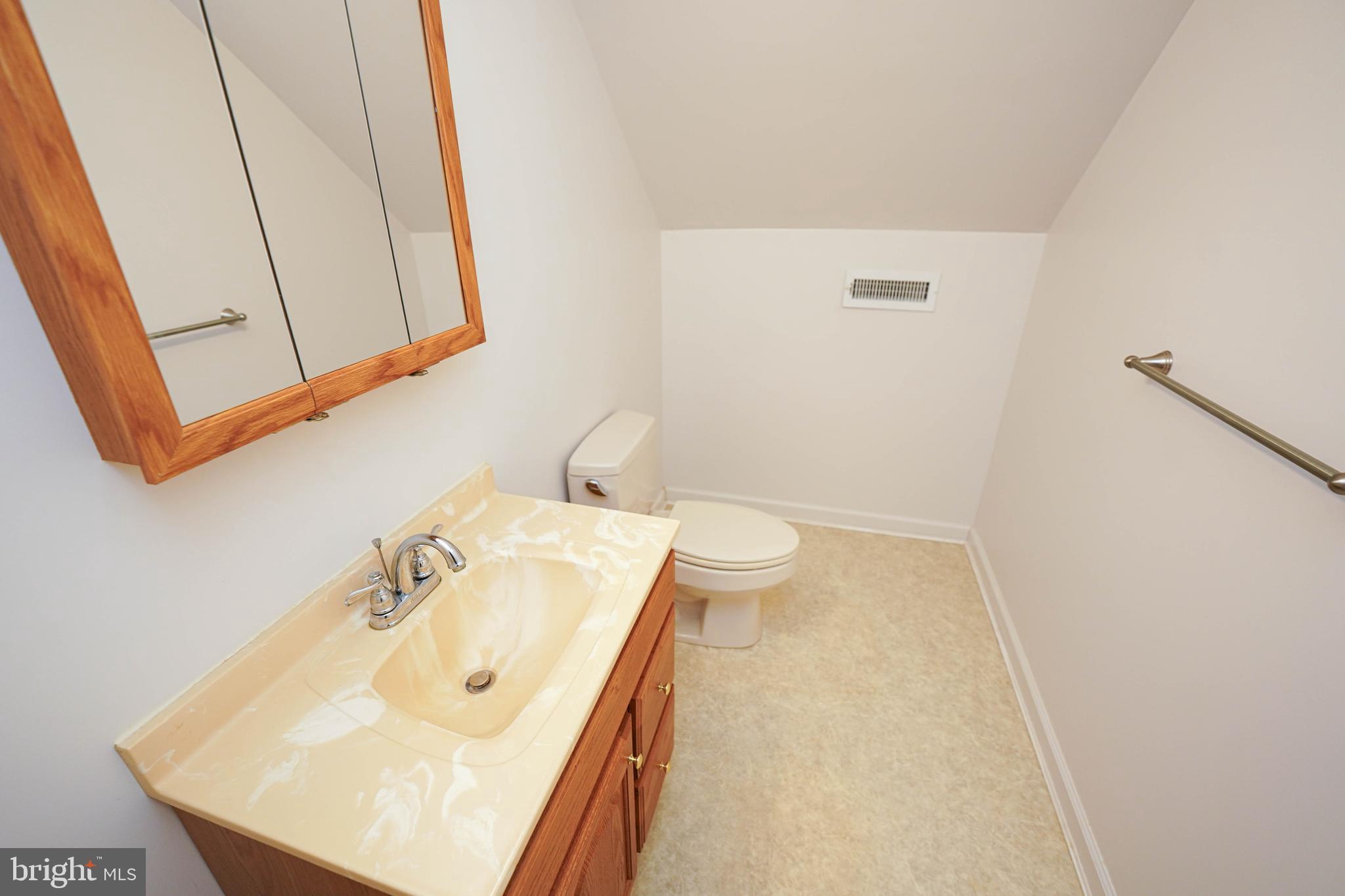 23290 Custom House Road Deal Island, MD 21821 - Photo 46 of 64 a bathroom with a sink a toilet and mirror