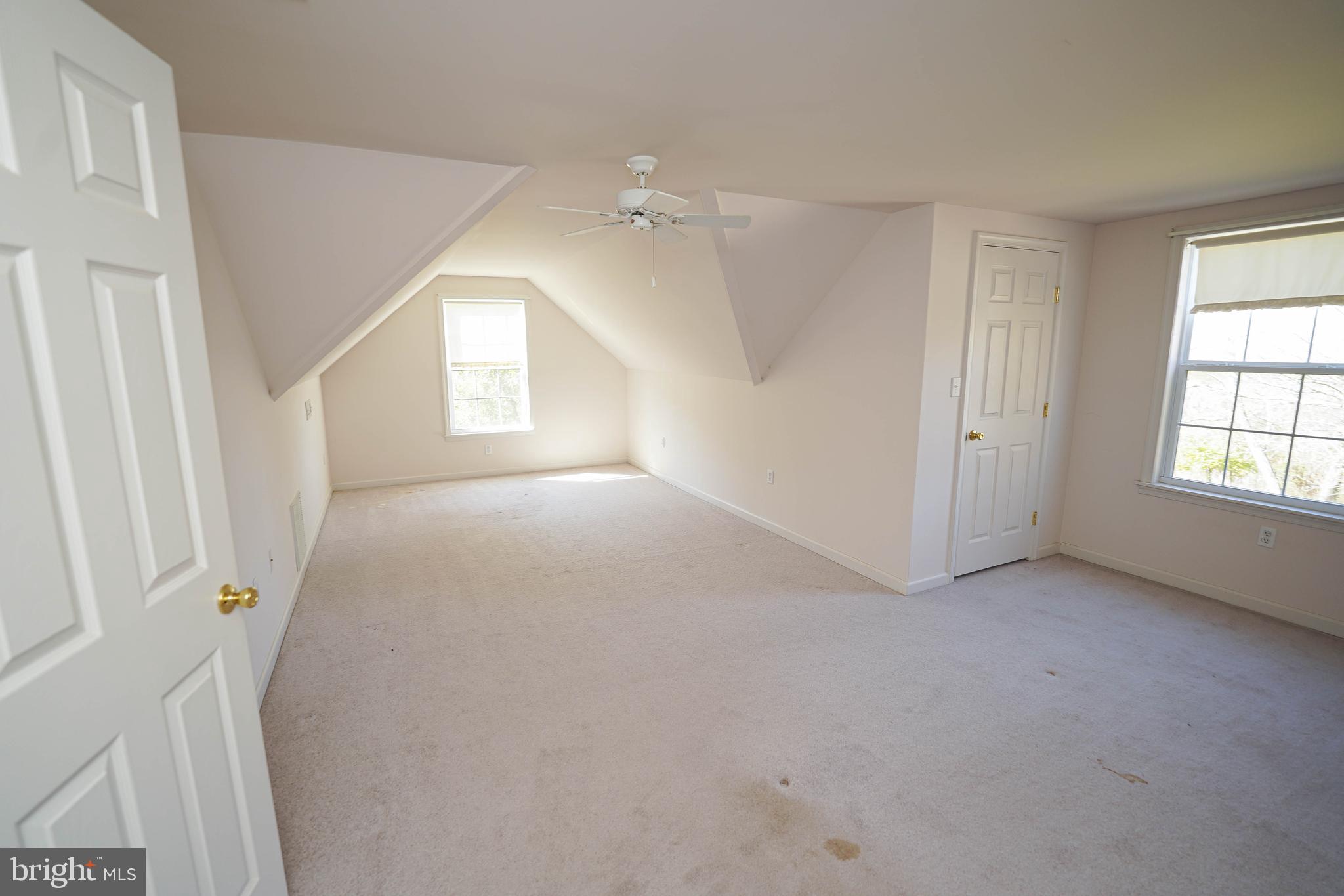 23290 Custom House Road Deal Island, MD 21821 - Photo 48 of 64 an empty room with windows and cabinet