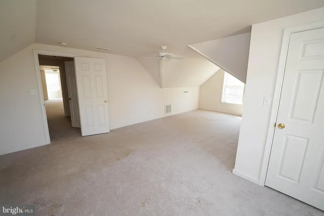 an aerial view of a house with outdoor space