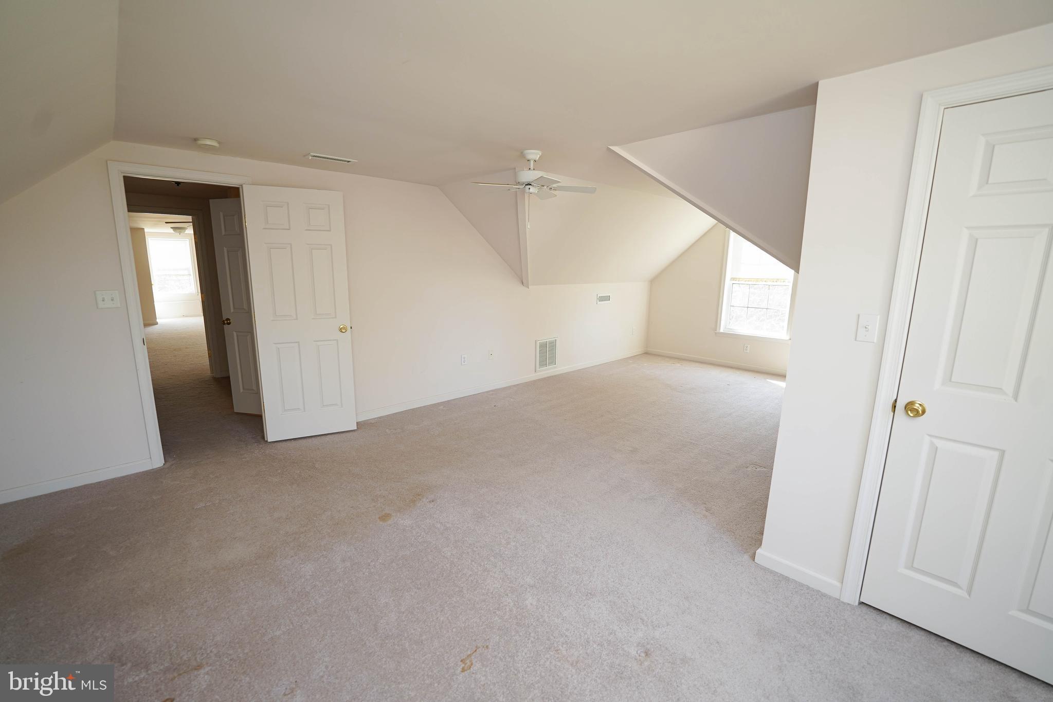 23290 Custom House Road Deal Island, MD 21821 - Photo 49 of 64 an empty room with windows and closet