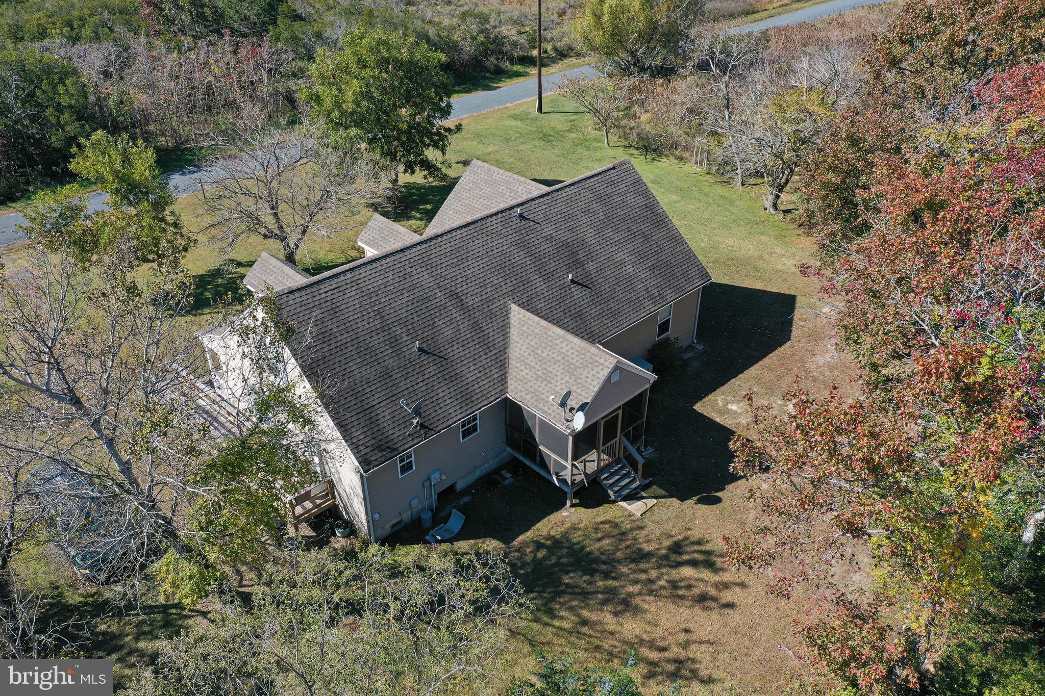 23290 Custom House Road Deal Island, MD 21821 - Photo 64 of 64 an aerial view of a house with a yard